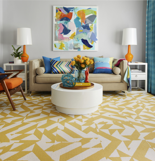 FLOR Twisted Spokes living room area rug shown in Maize